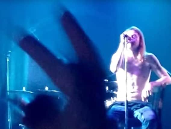 Angry fans flick V-signs at Puddle Of Mudd singer Wes Scantlin during the chaotic Diamond Live Lounge concert.