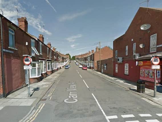 An 80-year-old woman was robbed in broad daylight on a Doncaster street yesterday afternoon.