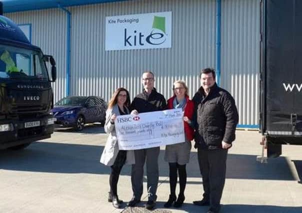 (L-R)., Rebecca Brooke, from Kite Packaging, Nicola and Ian Richardson from the Lullaby Trust and Chris OReilly, Managing Partner for Kite Packaging Rotherham. Rotherham Kite Packaging staff  have donated Â£1,000 to Lullaby.