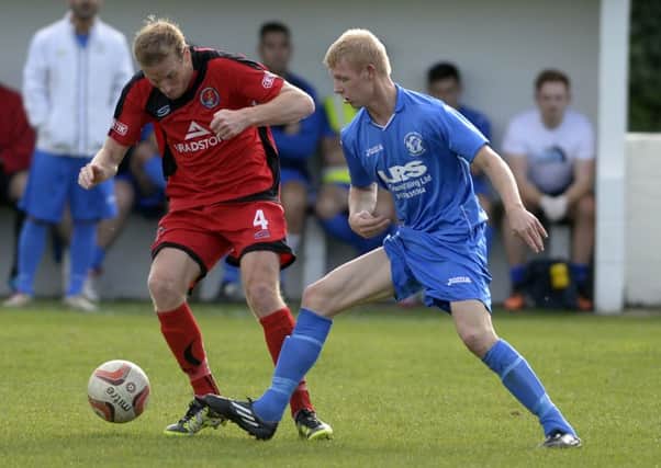 Craig Aspinall, right, equalised for Armthorpe.