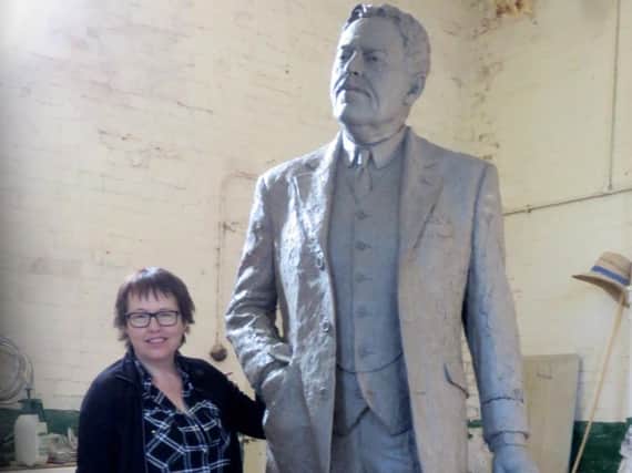 Sculptor Hazel Reeves with the statue of Sir Nigel Gresley nearing completion.