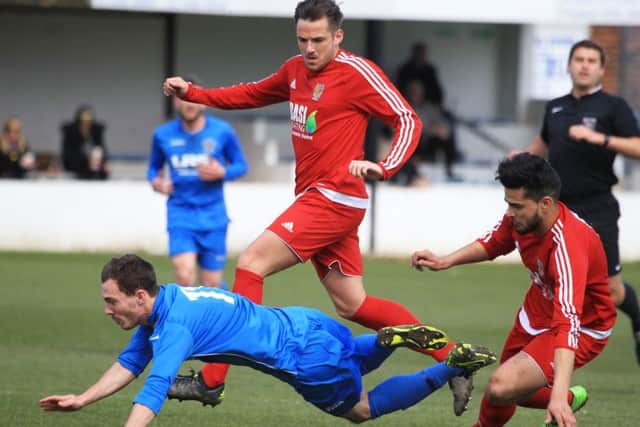 Matthew Semley takes a tumble during Armthorpe's draw with Albion Sports.