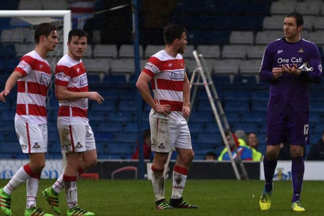 Doncaster's players after their defeat to Bury