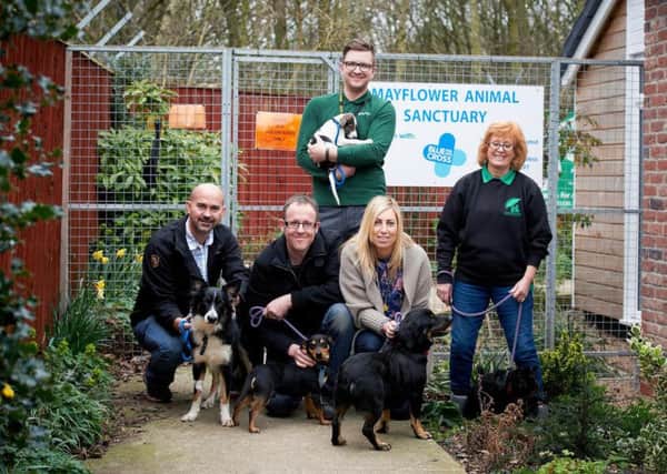 Left to right, Nathan Fetherston, Kazimieras Nika (standing), Jonathan Hewson, Teresa Mitchell & Jennie Foxall-Lord from Mayflower. Amazon have made a Â£500 donation to the Mayflower Sanctuary.
