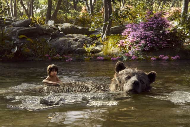 THE JUNGLE BOOK. Pictured: MOWGLI (Neel Sethi) and BALOO (voice of Bill Murray). PA Photo/Disney.