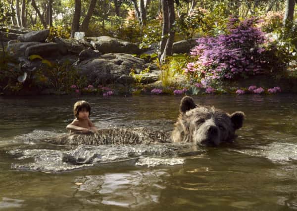 THE JUNGLE BOOK. Pictured: MOWGLI (Neel Sethi) and BALOO (voice of Bill Murray). PA Photo/Disney.