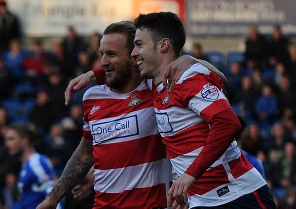 Tommy Rowe celebrates his goal with James Coppinger. Photo: Andrew Roe