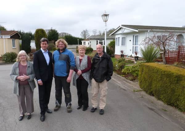 Ed Miliband pictured with Philip Horberry, who works at the site, and residents, at Wittsend Park, Arksey