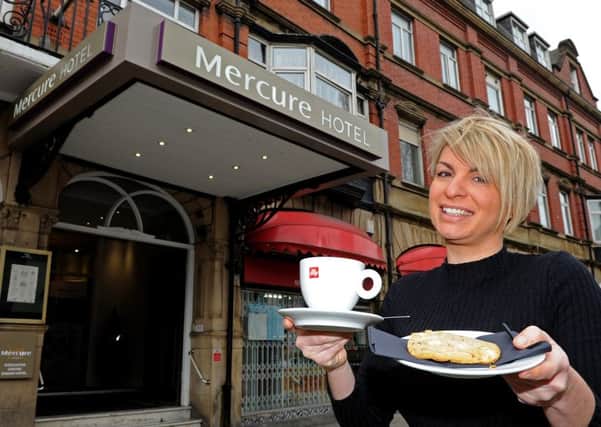 Hollie White, of Mercure Danum Hotel, holds a cookie which you get free with a large coffee. Picture: Andrew Roe