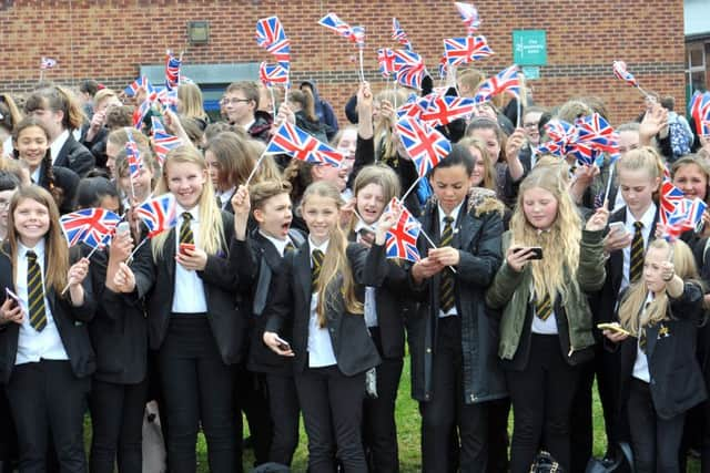 HRH Princess Anne Visit to Ulley sailing Club. Students from Aston Academy give HRH Pricess Anne a right royal send off as she leaves by helicopter from the school fields.