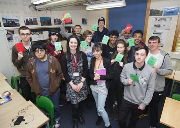 Hillsborough students take lessons in money skills
Jenny Webster from The Money Charity (red lanyard) and Rebecca Spencer, a Tutor Mentor at Hillsborough College (orange lanyard), with students after their money management class organised by The Money Charity and HML