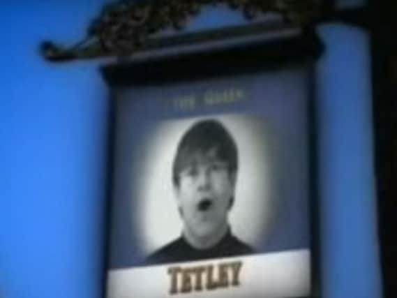 Sir Elton John's face super-imposed on the sign of The Queen pub. (Photo: YouTube).