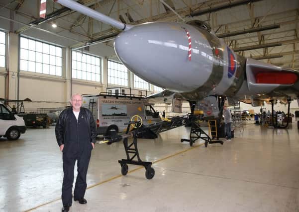 Pilot Martin Withers with the Vulcan in its Doncaster hangar