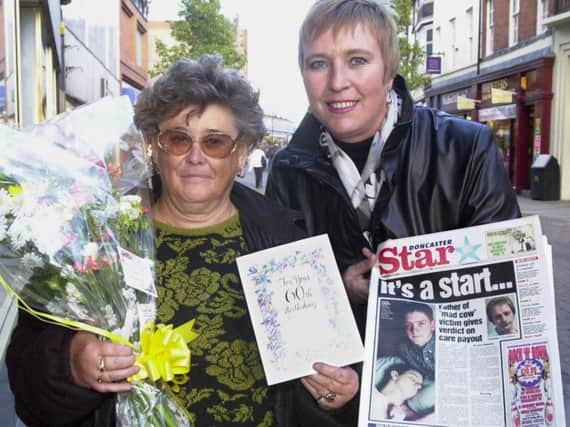 Newspaper vendor Josie Williams (left).