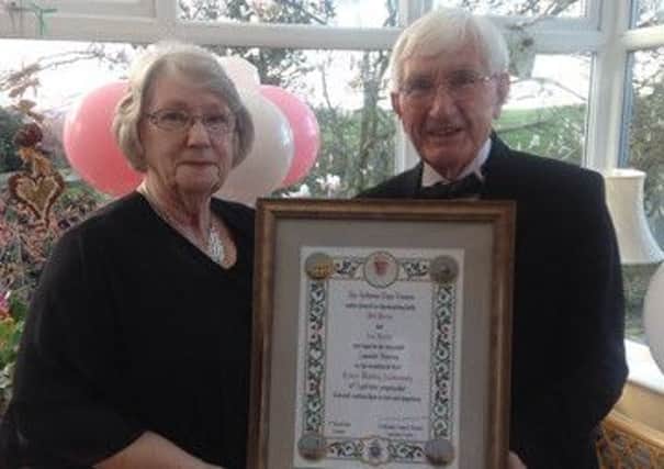 Bill and Ann Hurley holding their Papal Blessing.