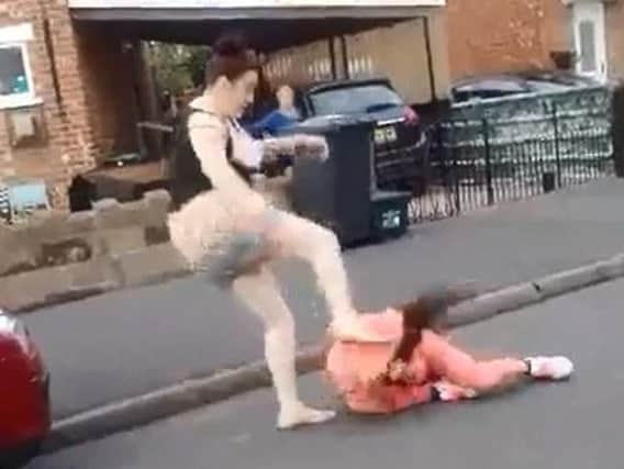 A scene from the shocking video showing two young women fighting in a Doncaster street.