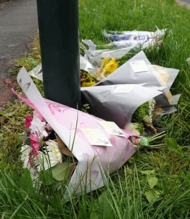 Floral tributes have been left on Braemoor Road at the junction with Wadsley Lane for Matthew Wilson, who was stabbed. Picture: Andrew Roe