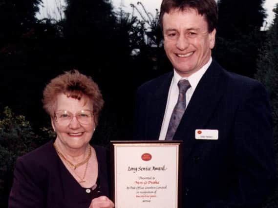 Gladys Drake is presented with her long service award in 1997.
