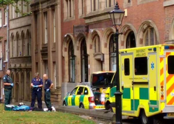 Paramedics attend to a street drinker  in the city centre. Residents claim people getting drunk and high on drugs are ruining the area as plans for a third off-licence goes to Sheffield Council planning committee - Photo: Sheffield City Centre Residents' Action Group