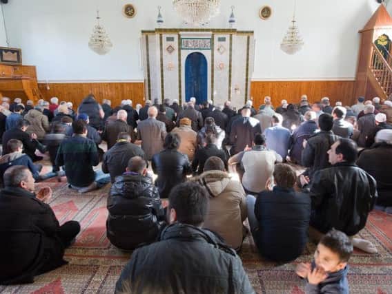 Muslims at prayer in a mosque