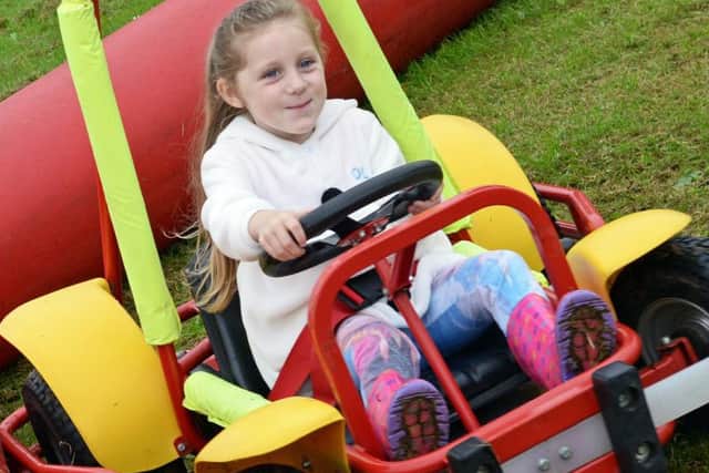 Bella-Mai Finnie, five, of Braithwell, pictured having fun at the Braithwell Church and Country fair. Picture: Marie Caley