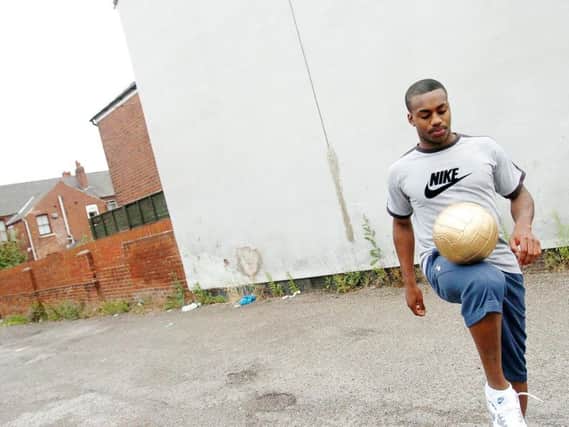 Danny Rose has a kickabout in the back streets of Doncaster in 2009. (Photo: Marie Caley).