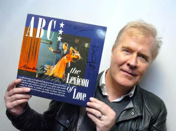 ABC lead singer Martin Fry with a signed copy of The Lexicon Of Love.