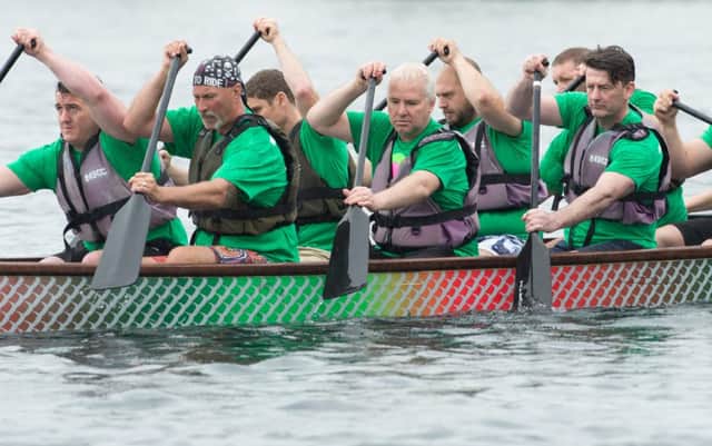 Dragon Boat Racing in the rain at Lakeside Doncaster