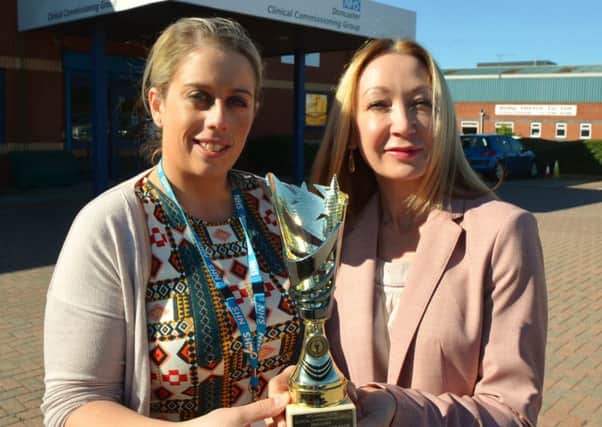 The locally based People Focussed Group (presented NHS Doncaster Clinical Commissioning Group with their True Peer Inclusion Award. Emma Smith and Andrea Butcher, from the trust's mental health team, are pictured here with the trophy, which they received at a special event at Doncaster Hub.