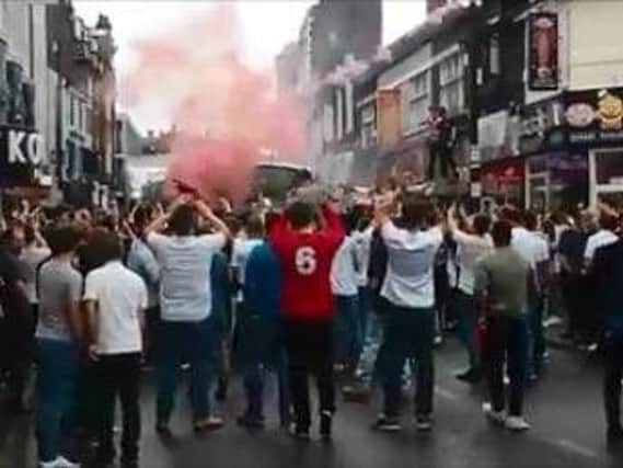Flares were discharged and traffic was brought to standstill on Silver Street yesterday afternoon as hundreds of cheering fans congregated in the middle of the road, following the conclusion of England's group stage match