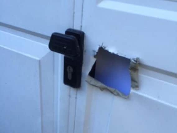 In the last month, police have received 13 reports of suspects forcing entry into properties in Bawtryby cutting holes in the garage doors so they can reach in and open the door (as pictured).