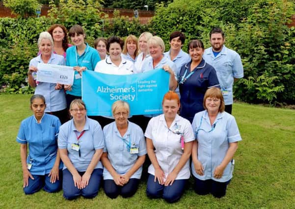 Zoe Barraclough pictured, second from the left in the middle row, together with the team who workat Tickhill Road Hospital.