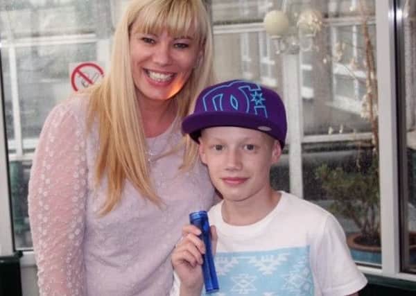 Liam Dunne and mum Jo Hobson prepare for Weston Park Hospital Cancer Charity's Light the Night walk.