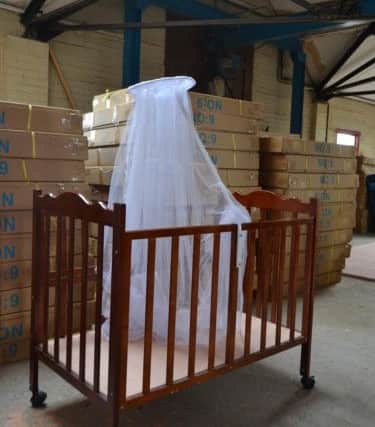 Pictures of unsafe baby cots that could have 'caused strangulation and led to a baby's fingers being cut off' that were seized by Doncaster Council's Trading Standards department.