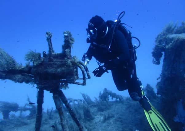 Scuba-dive - exploring below the surface