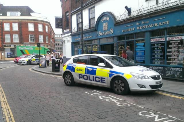 Police prevent traffic from coming on to Printing Office Street, Doncaster, after a male pedestrian was involved in a collision with a taxi on the corner of Printing Office Street and Priory Place