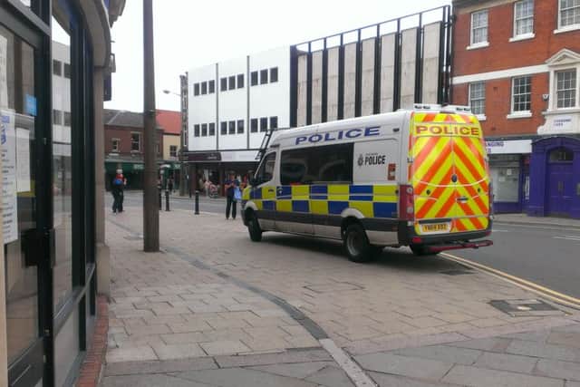 A police van outside the Doncaster Free Press offices, Printing Office Street, after a male pedestrian was involved in a collision with a taxi on the corner of Printing Office Street and Priory Place
