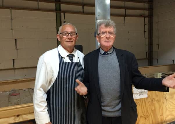 (L to R) Market traders Pat Queen and Mick Maye outside one of the empty stalls