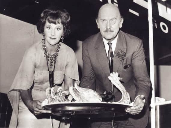 Fanny and Johnnie Cradock with one of their elaborate creations at Sheffield City Hall