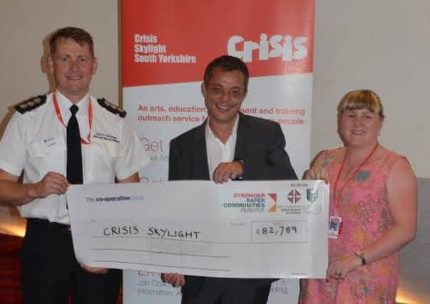 From l to r:- Station manager Darren Perrot, councillor Bob Johnson from South Yorkshire Fire and Rescue Authority and Mandy Carlson from Crisis Skylight.