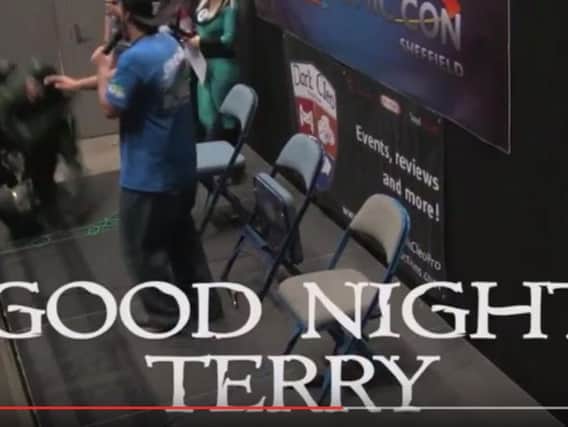 Terry (left) goes down as he prepares to enter the stage. (Photo: YouTube/Dark Cleo Productions).