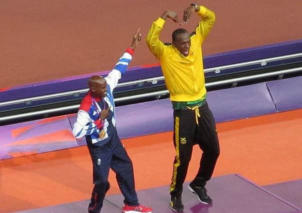 Mo Farah and Usain Bolt at the Olympics. Picture: Steven Lewarne