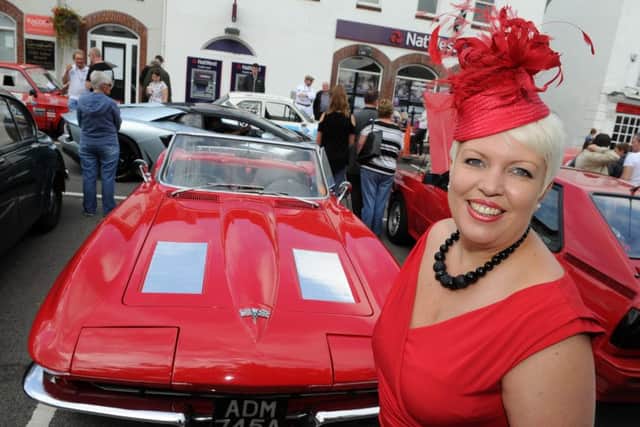 Debbie McGuire stands infront of a Corvette at a Historic, Classic and Supercars Pageant at Bawtry. Picture: Andrew Roe