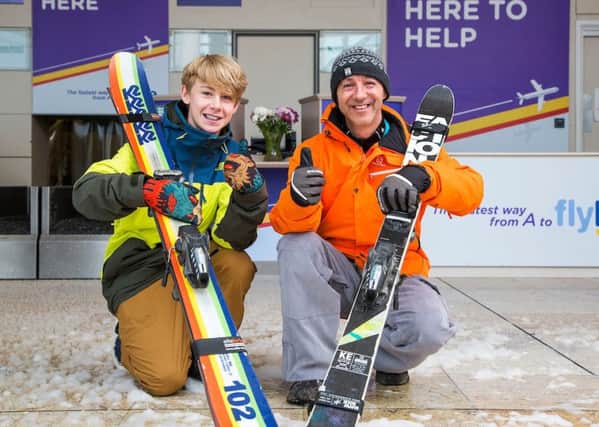 Stephen Gill CEO of Peel Airports Management and local skiier Mason Flannery from Sprotborough celebrate the launch of new flights to the ski resorts of Europe at Robin Hood Airport, Doncaster.
