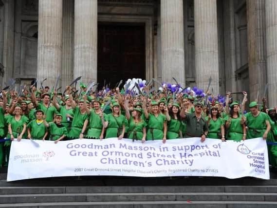 LONDON, ENGLAND - AUGUST 29: Fundraisers gather as Goodman Masson broke the Guinness World Record of the largest gathering of 'Peter Pans' in aid of Great Ormond Street Hospital at St Paul's Cathedral in August 2014.