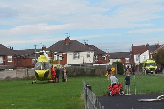 The air ambulance on Wrights Field behind Washington Grove, Bentley, Doncaster, on September 1 2016. There are reports that a child had fallen from a bedroom window.