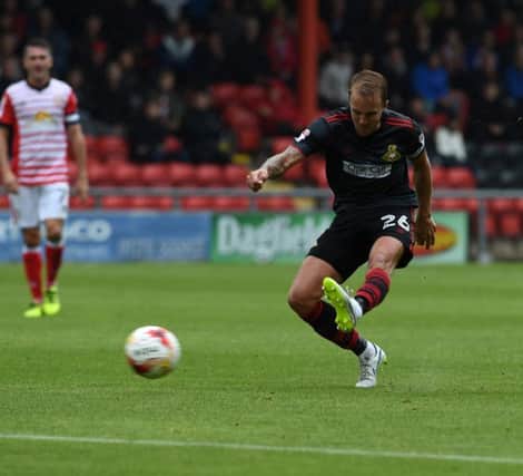 James Coppinger gets a shot in at Crewe