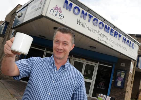 Paul Murray, of Montgomery Hall, Wath holds up a cup of coffee which is on offer. Picture: Andrew Roe
