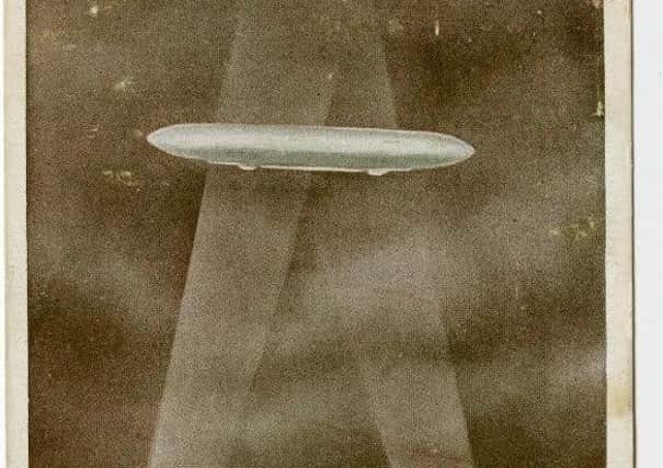 A postcard of a Zeppelin raid.