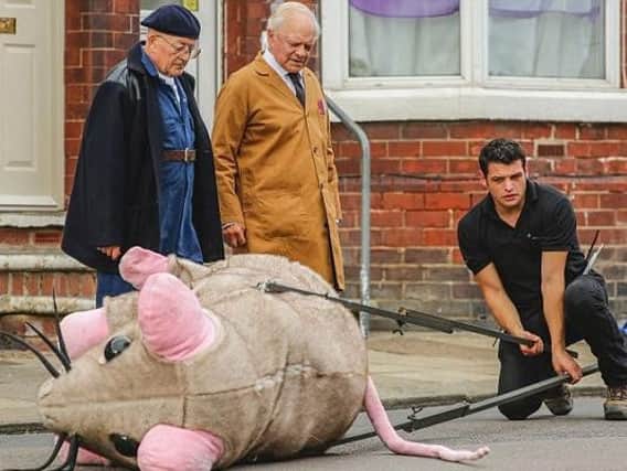 Tim Healy and David Jason with the giant mouse prop in Balby.
